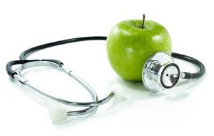protect your health with healthy nutrition.Stethoscope, apple